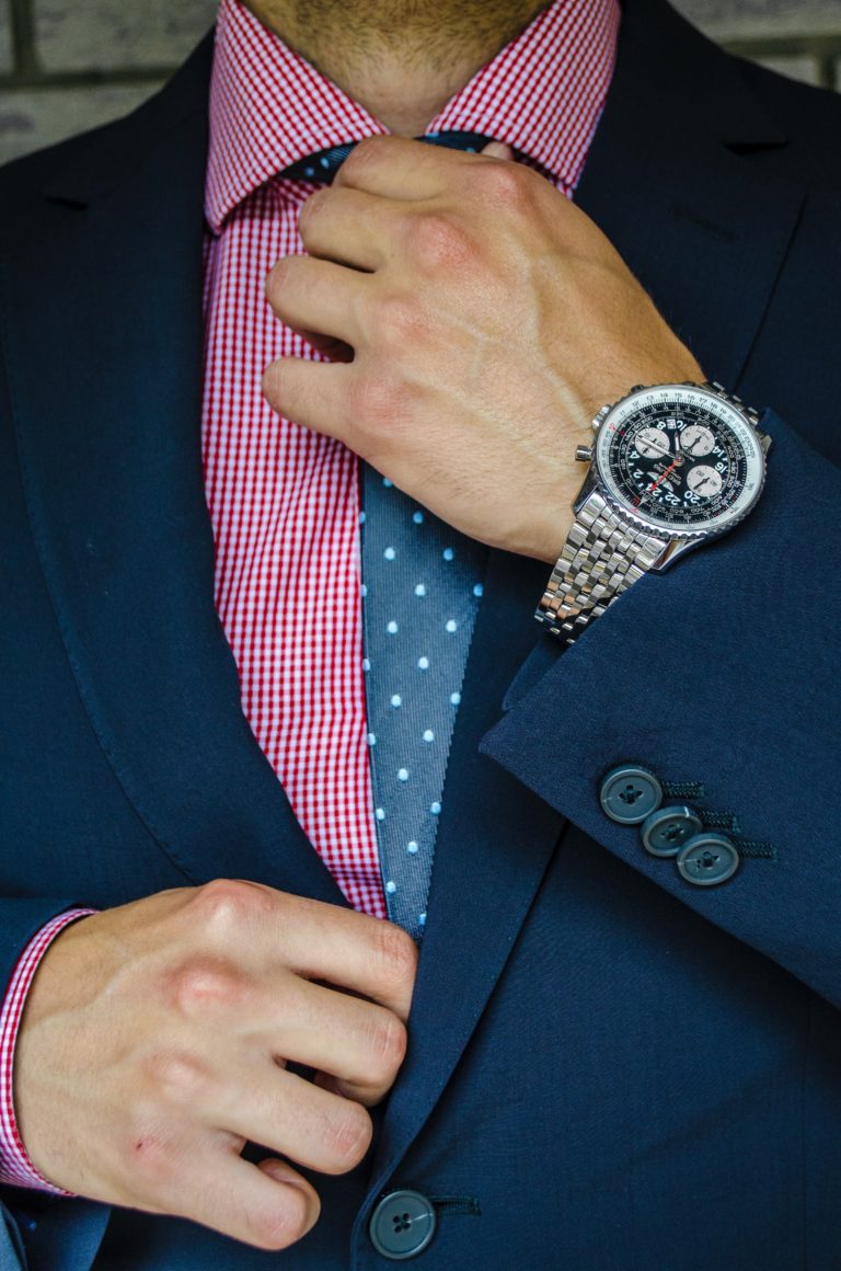 man with suit and expensive watch